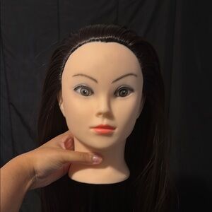 Brown, synthetic woman mannequin head